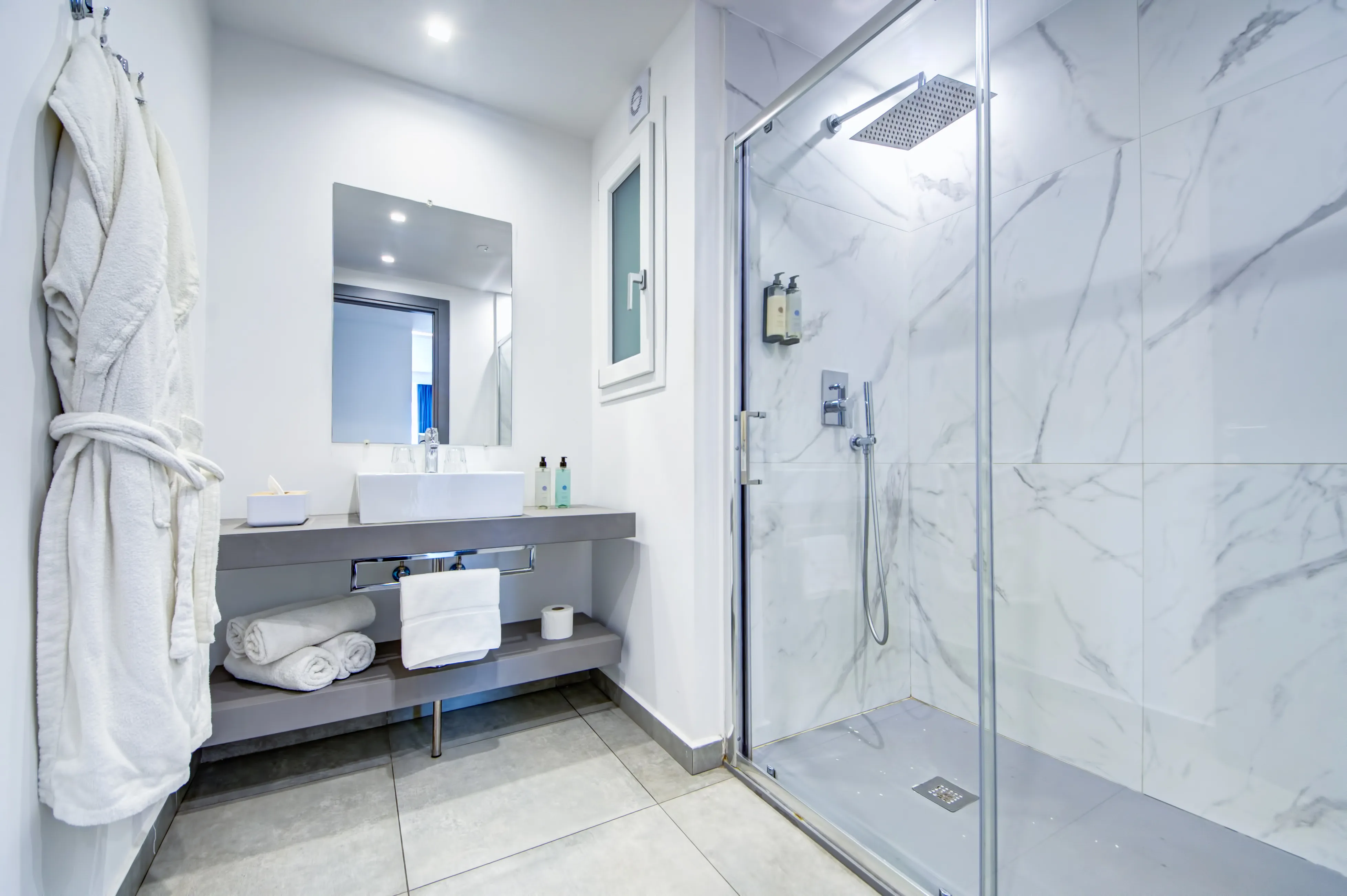 Modern marble bathroom with rain shower